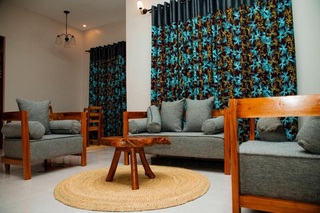 Suite lounge with timber furniture and local textiles
